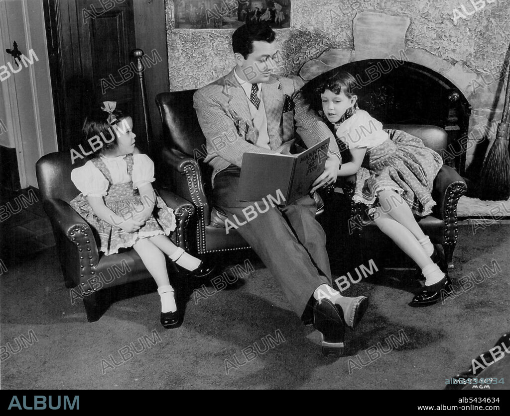 Robert Young, Metro-Goldwyn-Mayer actor, spends his days off from studio work reading and frolicking with his two daughters, Carole Ann and Barbara Queen. The actors newest film for *****. October 29, 1947.