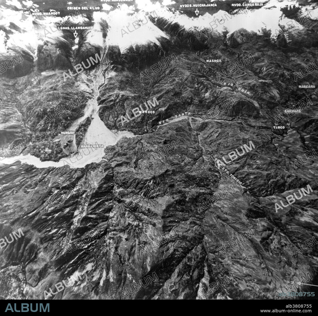 Aerial view showing mountain range including Nevada Huascaran, highest peak in Peru. Massive avalanche of ice and rock debris, triggered on North Peak by May 31, 1970 earthquake, buried towns of Yungay and Ranrahirca, killing more than 20,000 people. Avalanche started with sliding of mass of glacial ice and rock about 3,000 feet wide and one mile long that swept downslope about nine miles to Yungay at average speed of over 100 miles an hour. The 1970 Ancash earthquake was an undersea earthquake. Combined with a resultant landslide, it was the worst catastrophic natural disaster ever recorded in the history of Peru. The earthquake affected the Peruvian regions of Ancash and La Libertad. The epicenter of the earthquake was located 35 km off the coast of Casma and Chimbote on the Pacific Ocean, where the Nazca Plate is being subducted by the South American Plate. It had a magnitude of 7.9 to 8.0 on the Richter scale and an intensity of up to VIII on the Mercalli scale. No significant tsunami was reported. The earthquake struck on a Sunday afternoon at 15:23:31 local time (20:23:31 UTC) and lasted 45 seconds.