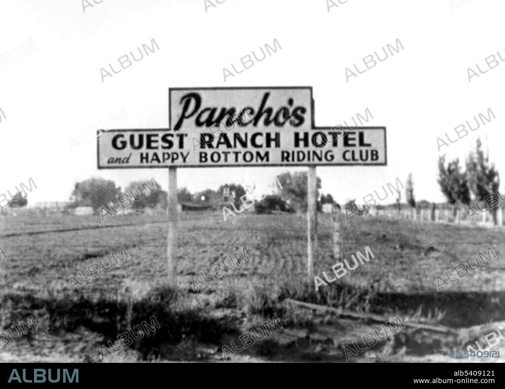 The Happy Bottom Riding Club (AKA Rancho Oro Verde Fly-Inn Dude Ranch) was a dude ranch, restaurant, and hotel operated by Pancho Barnes near Edwards AFB. The club was a favored hangout for test pilots and the Hollywood elite during the 1940s, boasting over 9,000 members worldwide. When the USAF intended to buy the club via eminent domain, a long series of lawsuits ensued. Barnes eventually won the lawsuits, but after the club was destroyed by fire in the 1950s, her plans to re-open in a nearby location never came to fruition. Courtesy of USAF, undated (cropped and cleaned).