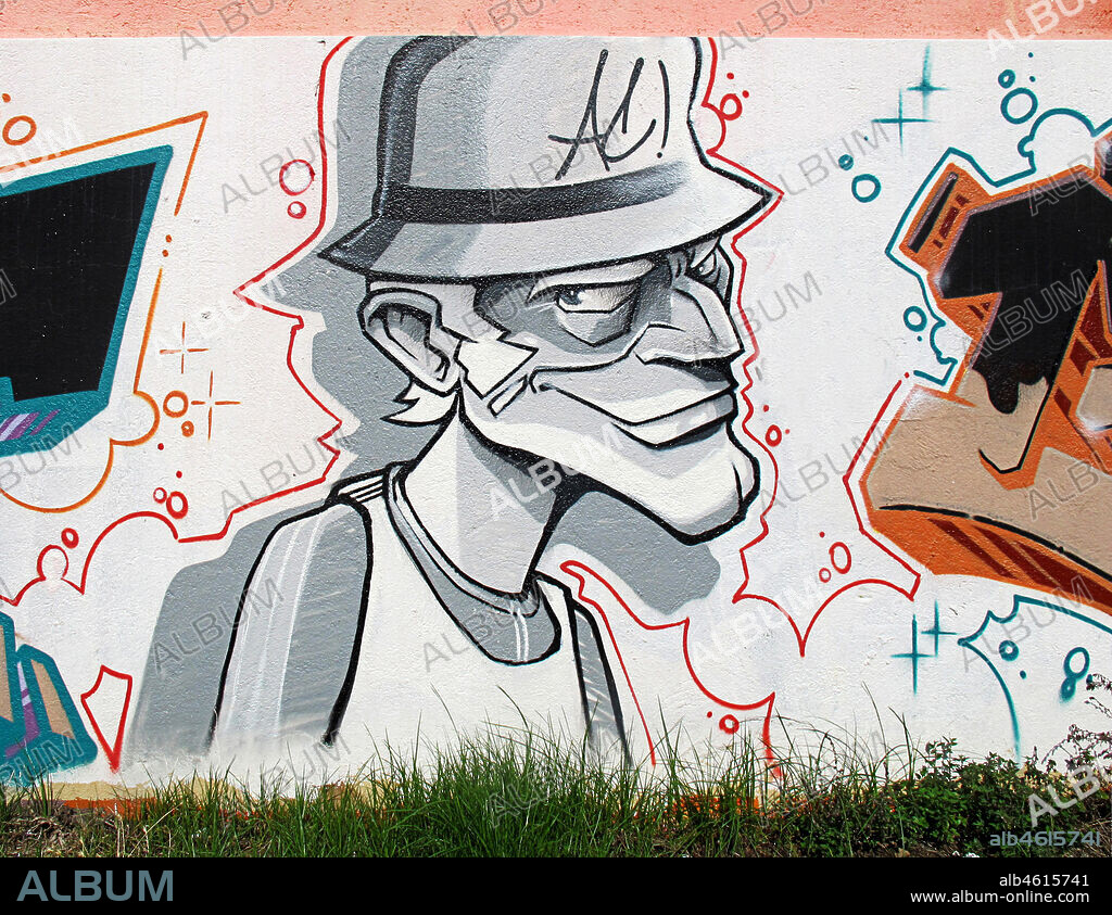 Ilustración estilo cómic de medio cuerpo de hombre con sombrero en blanco, negro y grises, con sombrero y mirada expresiva, graffiti mural, Mataró, provincia Barcelona, Barcelona en 2013.