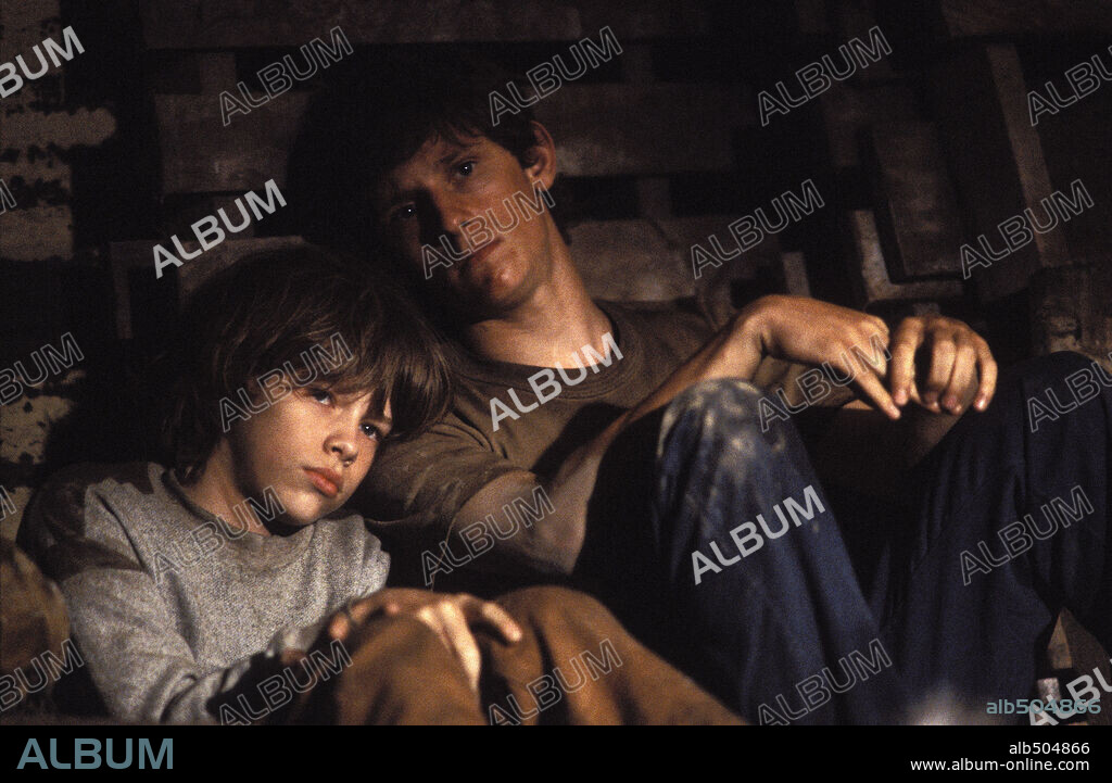 DEVON ALAN and JAMIE BELL in UNDERTOW, 2004, directed by DAVID GORDON GREEN. Copyright UNITED ARTISTS.