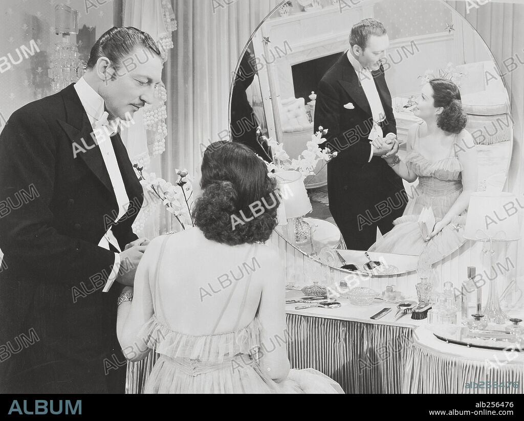 GAIL PATRICK and WARREN WILLIAM in WIVES UNDER SUSPICION, 1938, directed by JAMES WHALE. Copyright UNIVERSAL PICTURES.