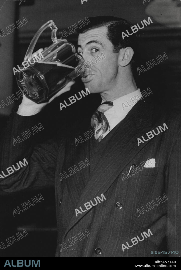 'The Overlander' Has A Thirst -- Chips Rafferty disposes of a pint of beer at the party.Chips Rafferty the Australian actor who scored a success in 'The Overlanders', British film made in Australia, attended a cocktail party in his honour at the Hungaria Restaurant, Lower Regent Street, London, before flying to New York to attend the American Premier of his film.He is to stay in New York for a few days and is then flying to Australia to make a new film.  November 21, 1946.