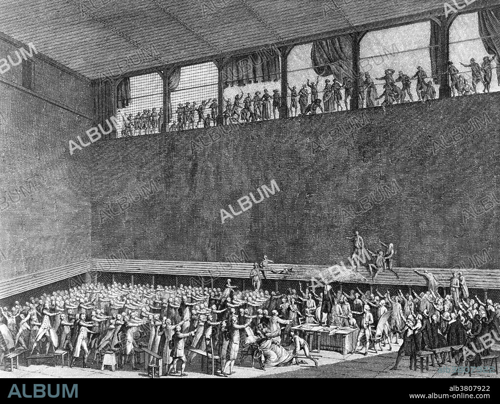 Entitled: "Serment du jeu de paume, Ã  Versailles." Shows a large group of people taking an oath at the tennis court, Versailles, during the French Revolution. The Tennis Court Oath was a pivotal event during the first days of the French Revolution. The Oath was a pledge signed by 576 of the 577 members from the Third Estate who were locked out of a meeting of the Estates-General on June 20, 1789. The only person who did not sign was Joseph Martin-Dauch from Castelnaudary, who would not execute decisions not decided by the king. They made a makeshift conference room inside a tennis court, located in the Saint-Louis district of the city of Versailles, near the Palace of Versailles. They took a solemn collective oath "not to separate, and to reassemble wherever circumstances require, until the constitution of the kingdom is established". The oath was both a revolutionary act, and an assertion that political authority derived from the people and their representatives rather than from the monarch himself. Their solidarity forced Louis XVI to order the clergy and the nobility to join with the Third Estate in the National Assembly in order to give the illusion that he controlled the National Assembly. Etching by Pierre Gabriel Berthault, 1804.