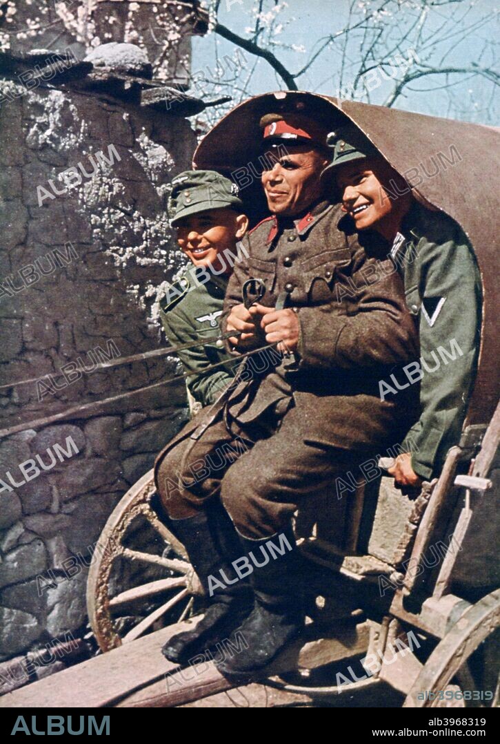 German alpine troops in a cart with a Bulgarian soldier, Struma Valley, Bulgaria, 1941. A print from Signal, 1941. Signal was a magazine published by the German Third Reich from 1940 through 1945.