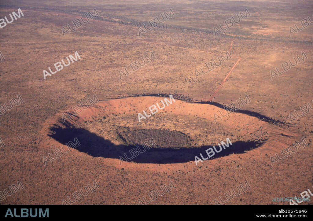 East Kimberley Wolfe Creek Crater in Western Australia. Located a 150K south of Halls Creek. It is the second largest meteorite crater in the world measuring 1 KM across and 50M high.