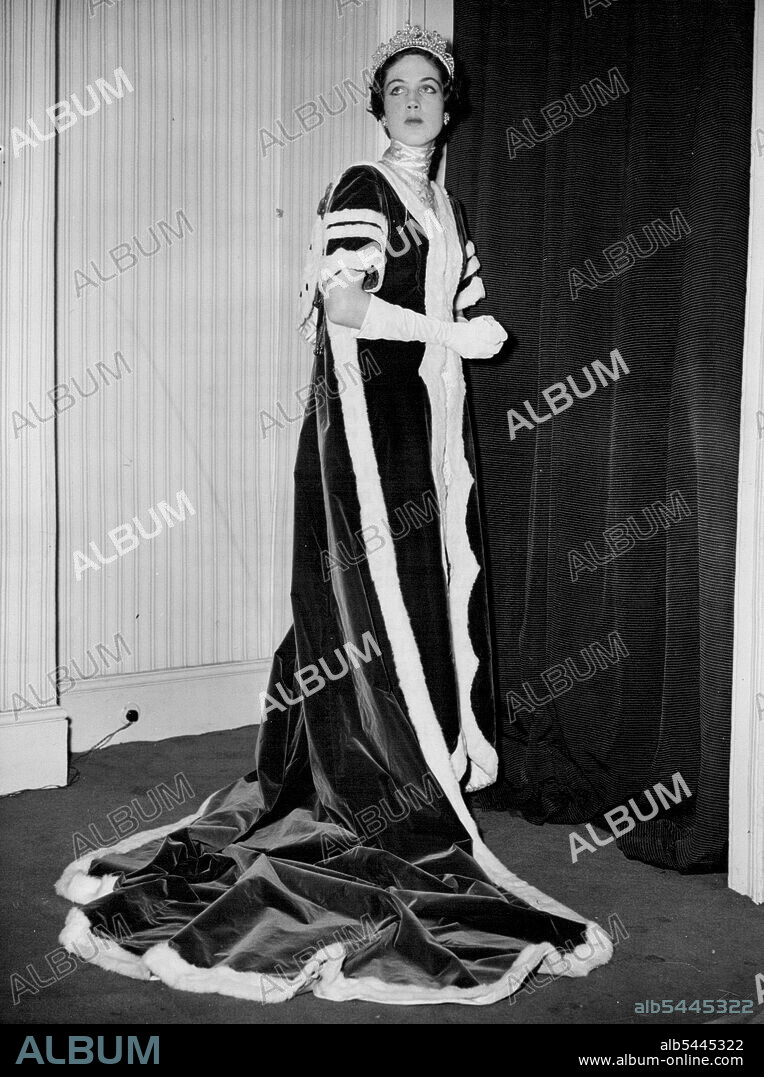 Queen Juliana will see Coronation Robe -- This Coronation robe will on view to Queen Juliana of the Netherlands when she attends a dress show tomorrow (Saturday). It is modelled here by Miss Margaret Du Cane at the Sloane Street (London) salon of Mr. Herbert Sidon, the Dutch fashion designer, whose creations will be shown in Amsterdam tomorrow and Sunday. Miss Du Cane is one of five English girls who will be there as models. This robe is essentially the same type of garment which has been worn at Coronations since George IV. September 05, 1952. (Photo by Reuterphoto).