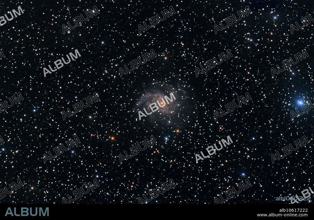 Spiral Galaxy NGC 6946 and Open Star Cluster NGC 6939. 80 Minute Exposure through a Takahashi Epsilon Scope and ST-8XME CCD LRGB.