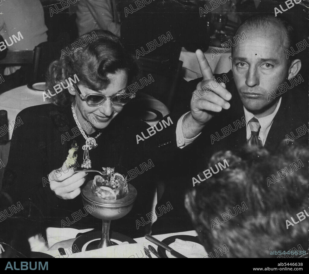 Don't You Dare! Bing Crosby (minus his Film wig) Waves a warning finger at Jay Scott at Ciro's Crosby's Wife, Dixie, is enjoying the Joke. Bing Crosby. I have read in people about all Types of entertainers, but never about the greatest of them all, Bing Crosby. Please, can we have a story About him E. Bramley, Mayfield, NSW. Some time ago, the President of Club Crosby requested you to publish a story about Bing. My fellow Members and I would be very Pleased and Grateful if you would Katherine Magel. Glebe Pt., NSW. Patience. Please. The Bing Takes a lot of Covering. December 21, 1947.