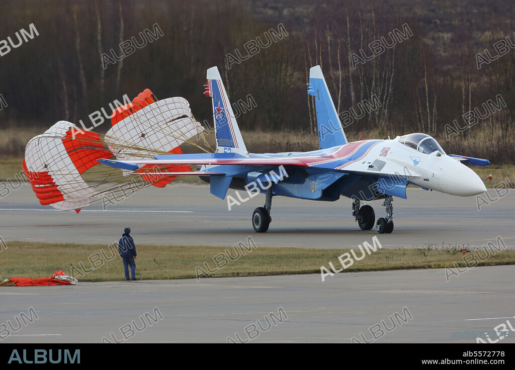 Sukhoi Su-35S jet fighter of the Russian Knights aerobatics team of the Russian Air Force with drag chute deployed, Kubinka, Russia.