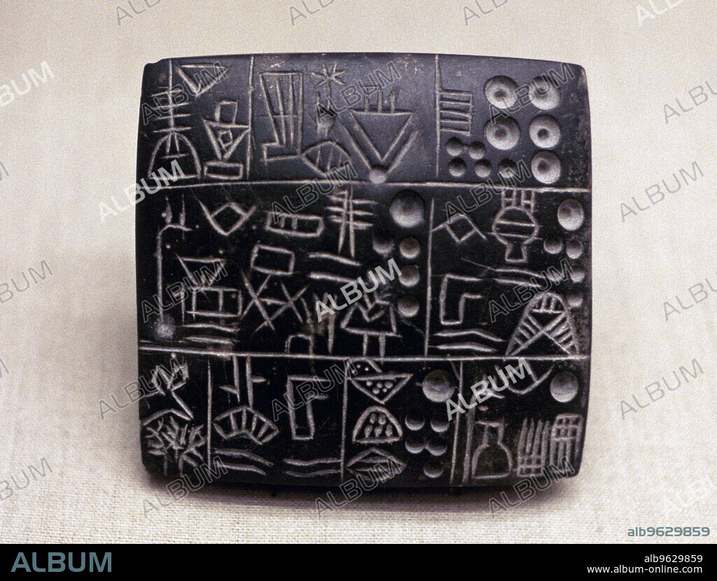 Administrative tablet of clay, Mesopotamian/Sumerian, 3100-2900 BC. The earliest tablets with written inscriptions represent the work of administrators, perhaps of large temple institutions, recording the allocation of rations or the movement and storage of goods. The pictographs were inscribed into the tablet with a sharp instrument. From the Los Angeles County Museum of Art, California, USA.