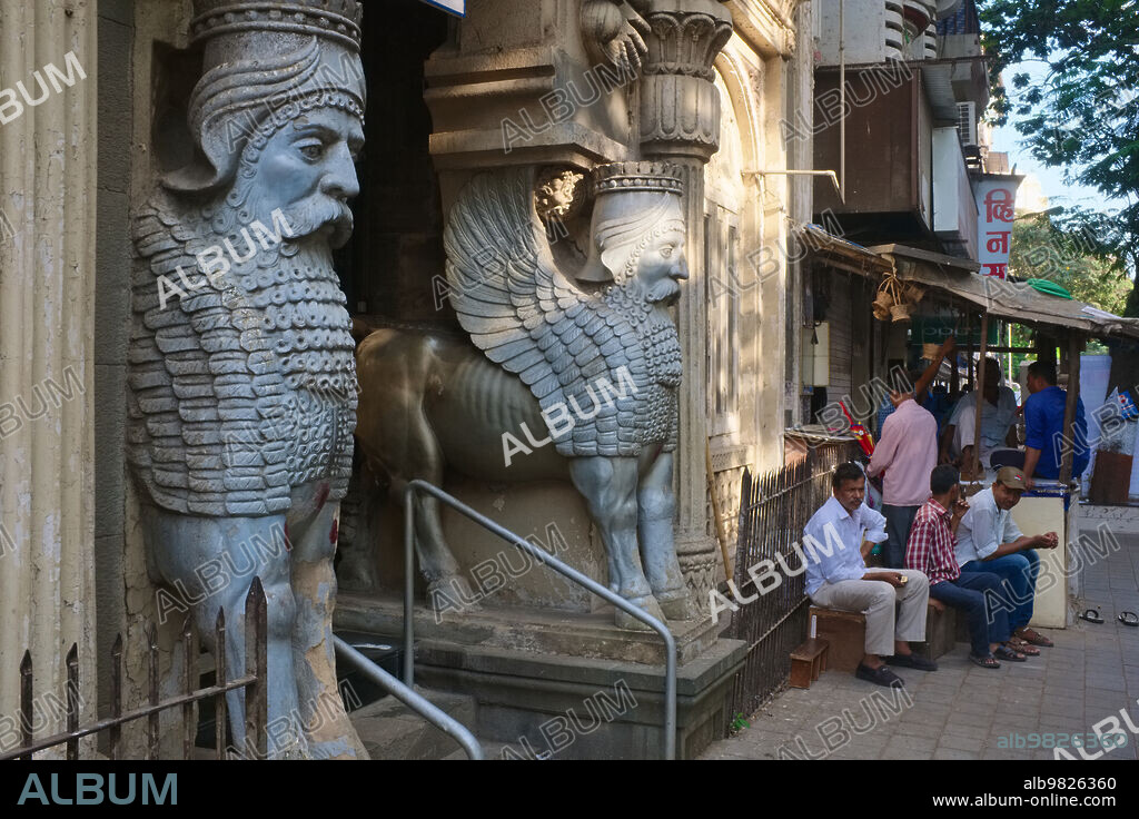 India: Two Shedu Lamassu (Repeller of Evil) statues outside the Maneckji Seth Agiary, a Parsee Zoroastrian fire temple in the Fort area, Mumbai. The Maneckji Seth Agiary was constructed in a mix of Persian and Greek styles in 1735.