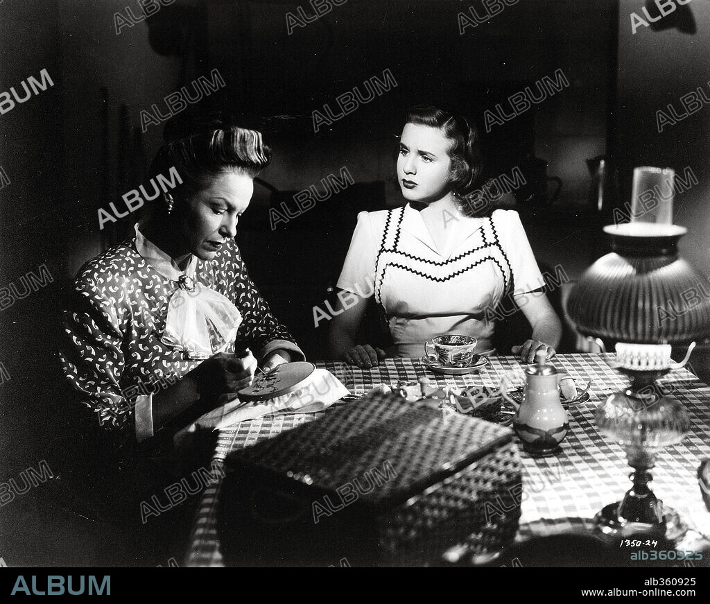 DEANNA DURBIN and GALE SONDERGAARD in CHRISTMAS HOLIDAY, 1944, directed by ROBERT SIODMAK. Copyright UNIVERSAL PICTURES.
