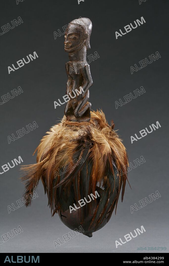 ritual rattle with human figure, Kusu, early 20th century, wood, gourd, feathers, fiber, H: 9-1/16 in., African Art.
