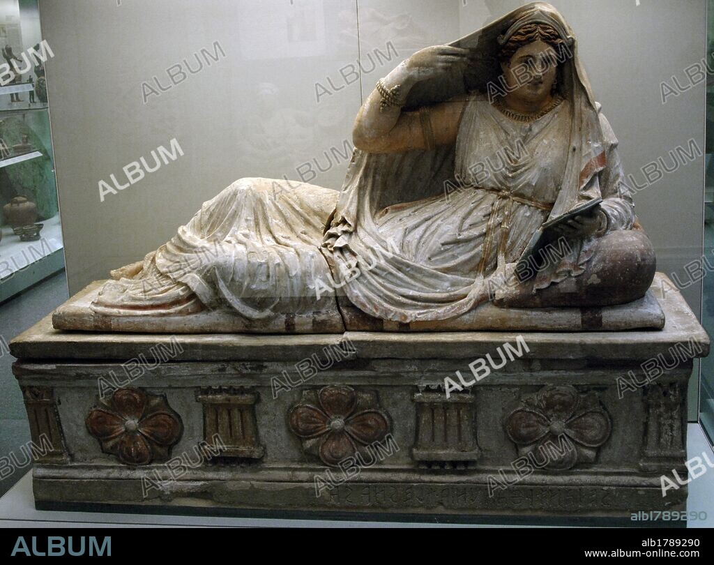 Etruscan sarcophagus of Seianti Hanunia Tlesnasa. Polychromed terracotta. 150-140 BC. Is depicted reclined and resting on a pillow, holding a mirror in her left hand and putting the cloak with right hand. From Poggio Cantarello (near Chiusi, Italy). British Museum. London. England. United Kingdom.