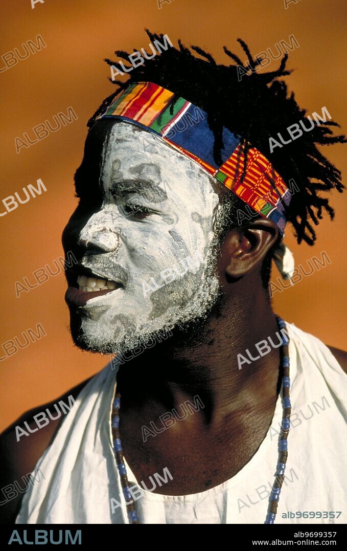 An Ashanti Akan musician, wearing face paint at a cultural festival in Accra, the capital of Ghana - West Africa.