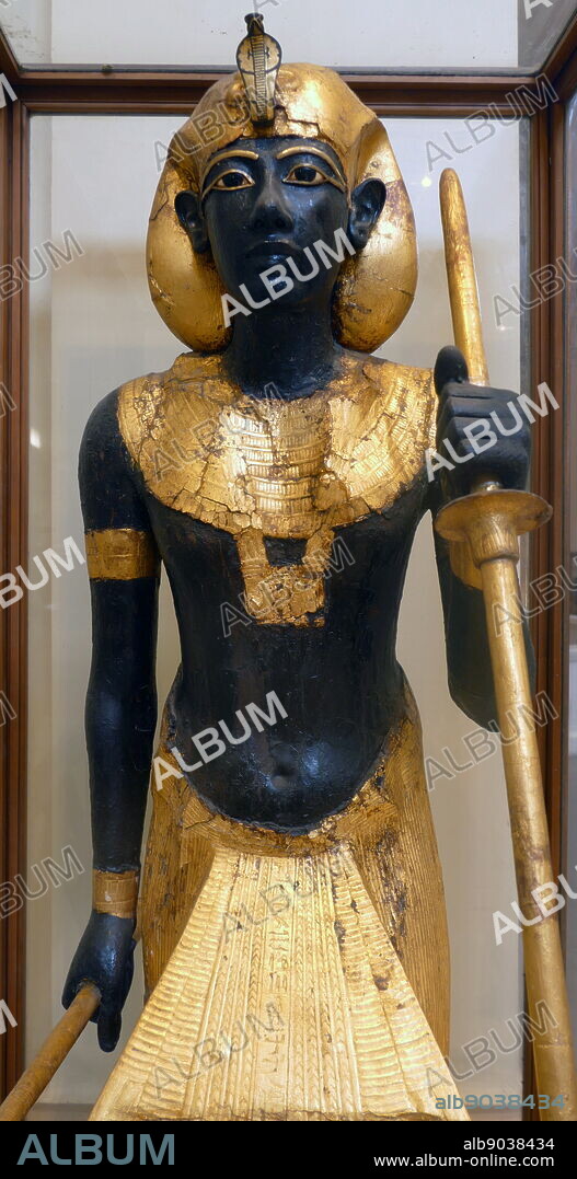 gilded wooden guardian statues from King Tutankhamen's burial chamber. Tutankhamen was an Egyptian pharaoh of the 18th dynasty (ruled c. 13321323 BC), during the period of Egyptian history known as the New Kingdom.