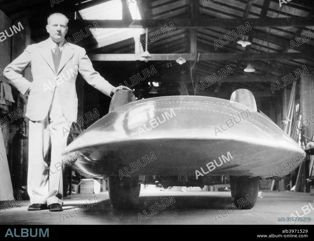 John Cobb with the Railton Special, 1938. Cobb set Land Speed Records in this car at Bonneville Salt Flats, Utah, USA. In 1947, when he set the record at 394.19 mph, on one of the required two runs he exceeded 400 mph, the first man to break this barrier. He was killed in 1952 when, attempting to break the water speed record, his boat disintegrated at high speed on Loch Ness.