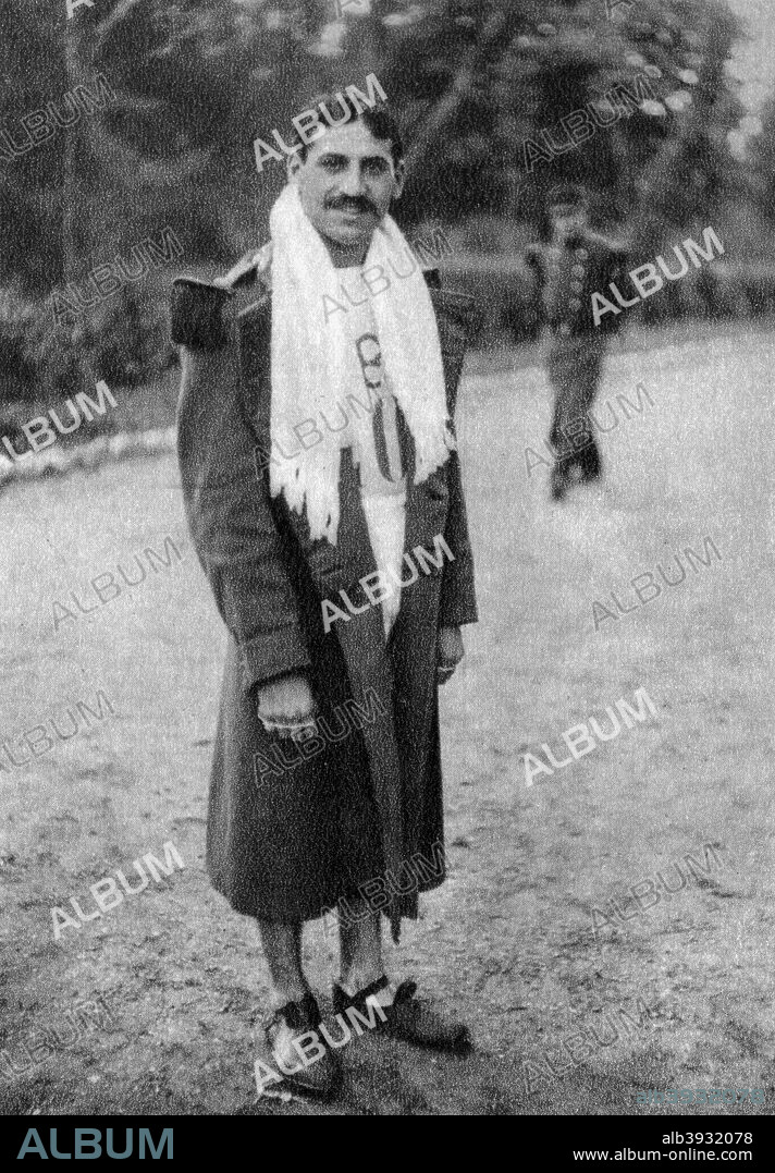 Jean Bouin, French soldier and athlete, 1912. Bouin (1888-1914) competed at the 1908 Summer Olympics in London and at the 1912 Games in Stockholm, where he won a silver medal in the 5000 metres. A sergeant in the French Army in World War I, he was killed near Saint-Michel, Marne. A photograph from Album de Photographies, Dans L'Intimite de Personnages Illustres, 1855-1915, Editions MD, 22 Rue de L'Arcade, Paris 8, 1855-1915.