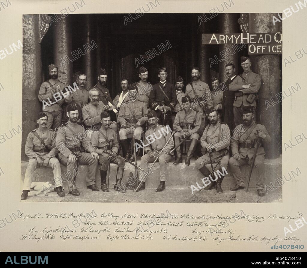 WILLOUGHBY WALLACE HOOPER. Group of General Prendergast. 17 Dec 1885. Group of General Prendergast and many of his staff, taken in front of the Hall of Audience in Mandalay Palace, on 17th December, 1885. Sitters named as follows: 'Capt Milne, DAQMG; Brig Gen Foord; Col Bengough, AAG; Lt Col Laughton, PCO; Lt Ballard, RN; Capt Sanders, RA; Mr Barton Groves (Post Gen); Lt Quenton Agnew; Major Walker, DAQMG; Lt Col Protheroe, DAAG; Capt Wilkieson, RE; Surg Major Mackinnon; Col Carey, RA; Lieut Gen Prendergast, VC; Surg Gen Donelly; Lt Learoyd, RE; Capt Macpherson; Capt Aldworth, ADG; Col Sandford, CRE; Major Rowland Hill; Surg Major Sibthorpe'.  Originally published/produced in 17 Dec 1885. . Source: OIOC Photo 312/(23),.