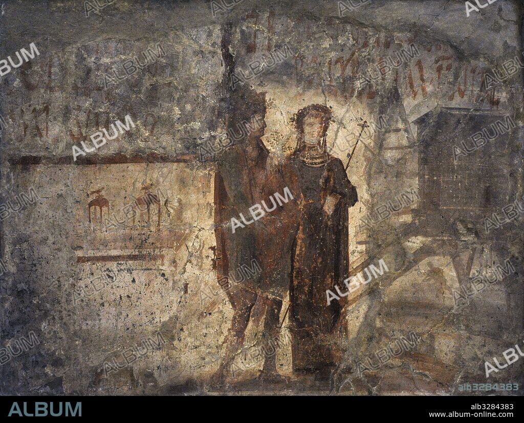 The painting of Liber Pater, recognizable from his castellated crown, the branch in his hands and his shoes, and Libera (not Pompeian Venus, the tutelary goddess of the city) comes from the facade of a building. The construction of a temple, and the equipament used by fullers can be seen in the background. The electoral inscriptions in support of C. Iulius Polybius and C. Lollius Fuscus, date to Ad 73 and Ad 78 respectively.  Pompeii, southern facade f VI. National Archaeological Museum. Naples. Italy.