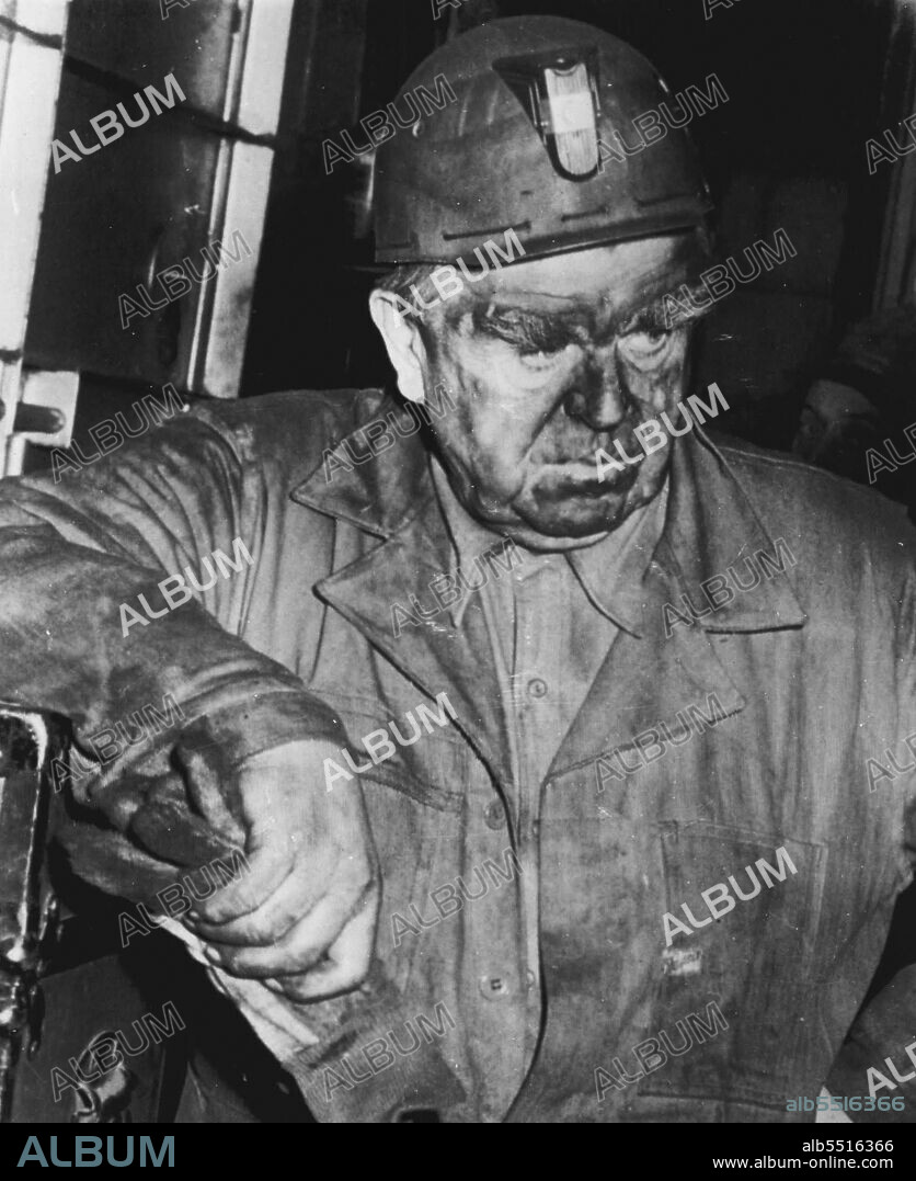'No Comment' -- John L. Lewis, President of United Mine Workers Union, after he emerged from Orient Mine No. 2 yesterday, following an eight-hour inspection of scene of explosion where 119 miners were killed. Tired and dirty Lewis said he had reached his "own definite conclusions" but would make no further comment. December 27, 1951. (Photo by AP Wirephoto).