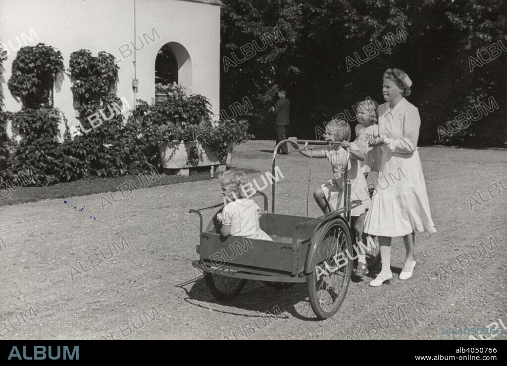 The three Princesses of Haga, Sweden, 1940s. Princess Margaretha (1934-), Princess Birgitta (1937-) and Princess Desiree (1938-), the three eldest children of Prince Gustaf Adolf, Duke of Västerbotten and Princess Sibylla of Saxe-Coburg and Gotha. They are pictured with their nanny, Miss Nenne Björnberg (1913-1994) on holiday at Solliden Castle, Öland.