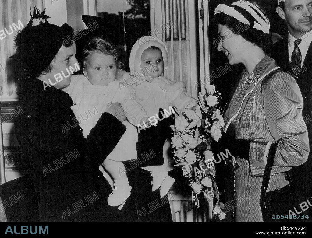 Princess Meets Two Babies Born Same Day as Princess Anne - Worthing: Smiling Princess Elizabeth is introduced to Mrs. Green and her baby Diana Mary, and Mrs. J.Harris and her daughter Mary Joyce, when she visited Courtland Hospital, Worthing, during her tour of the south coast. The two babies were both born on the same day as Princess Anne, youngest child of the same day as Princess Anne, youngest child of the Princess and the Duke of Edinburgh. May 19, 1951.
