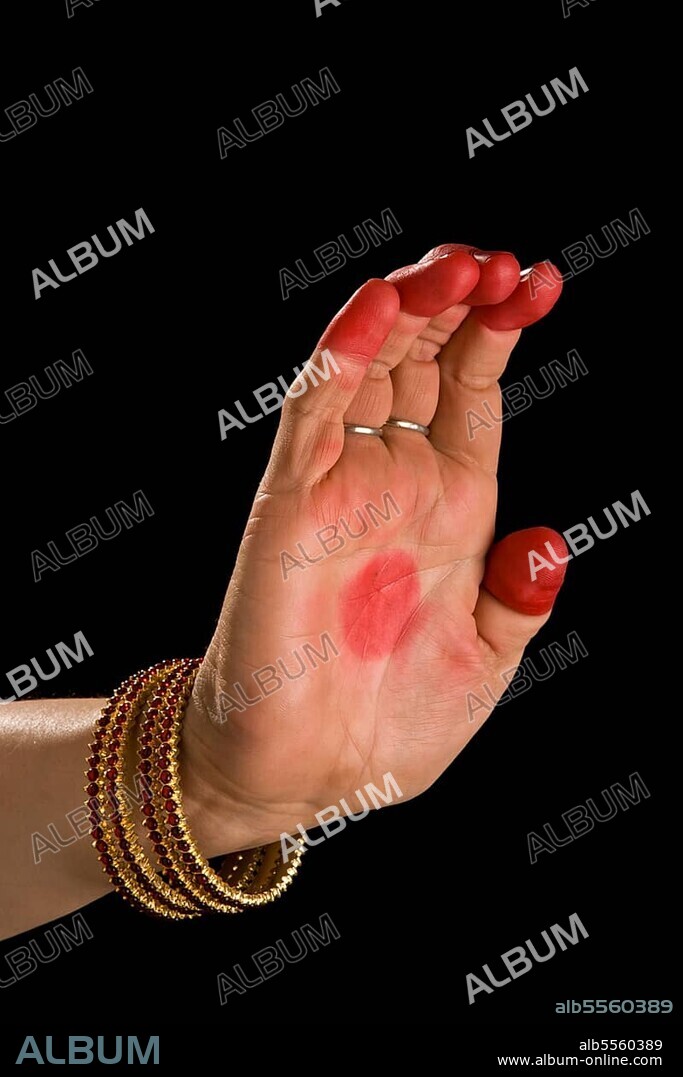 Woman hand showing Sarpashira hasta (hand gesture) (also called mudra) (meaning "Snake hood") of indian classic dance Bharata Natyam. Also used in Indian dances Odissi and Kuchipudi