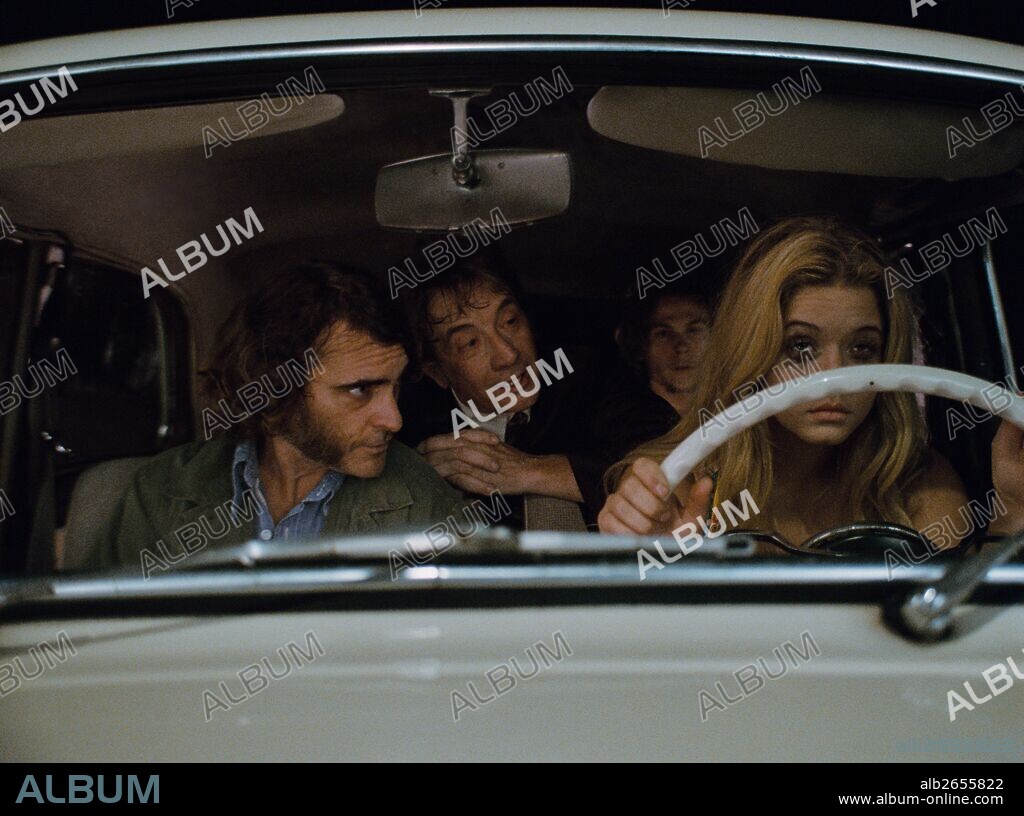 JOAQUIN PHOENIX, JORDAN CHRISTIAN HEARN, MARTIN SHORT and SASHA PIETERSE in INHERENT VICE, 2014, directed by PAUL THOMAS ANDERSON. Copyright WARNER BROS.