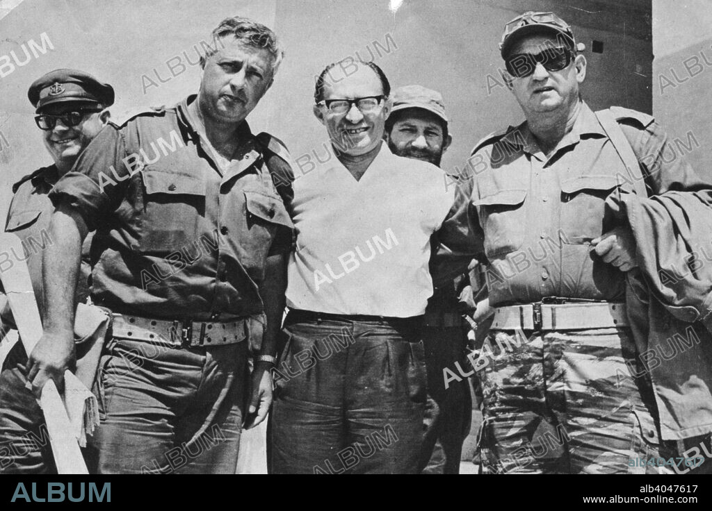 Menachem Begin (1913-1992), 6th Prime Minister of Israel, during the Six Day War, 1967. Brigadier General Ariel Sharon (left), Minister without Portfolio Menachem Begin, and Brigadier General Avraham Yoffe, link arms in Tel Aviv at the end of a victory press conference.
