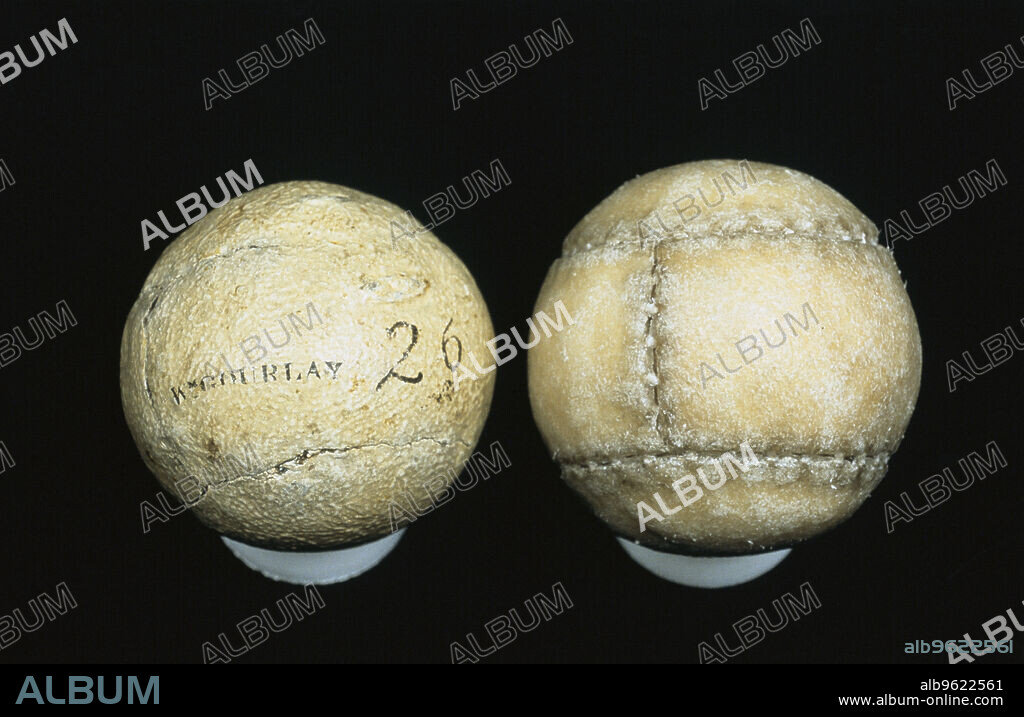Original and reproduction of feathery golf balls, original c1830-c1840. Made by William Gourlay, c1830-c1840.