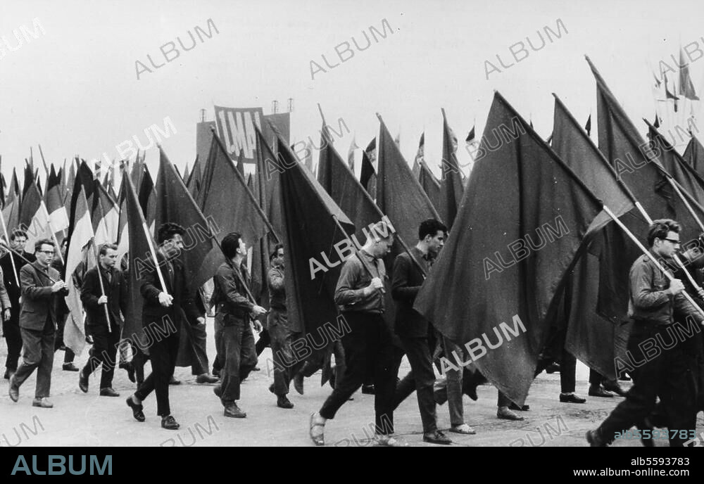 East Berlkin, 1st May 1962. 1st of May rally. - Young people with red flags and GDR national flags. Photo.