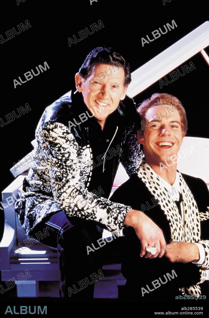 DENNIS QUAID and JERRY LEE LEWIS in GREAT BALLS OF FIRE!, 1989, directed by JIM MCBRIDE. Copyright ORION PICTURES.