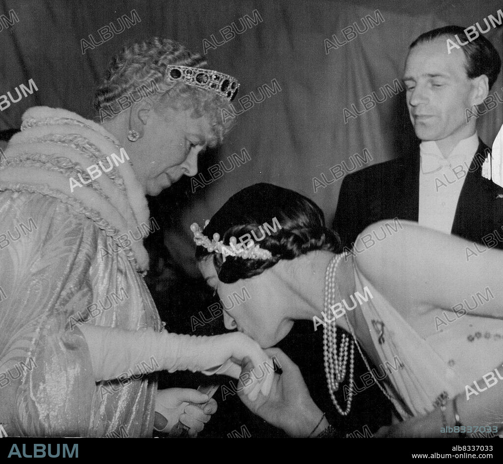 Queen Mary And Duke And Duchess Of Kent Attend Gala Performance At Coliseum -- The Grand Duchess Xenia of Russia kissing Queen Mary's hand on her Majesties arrival at the Theatre. Queen Mary and the Duke and Duchess of Kent this evening attended the gala performance of the Ballets De Monte Carlo, at the Coliseum Theatre in aid of the grand Duchess Xenia of Russia's summer camp for children. May 31, 1937. (Photo by Keystone).