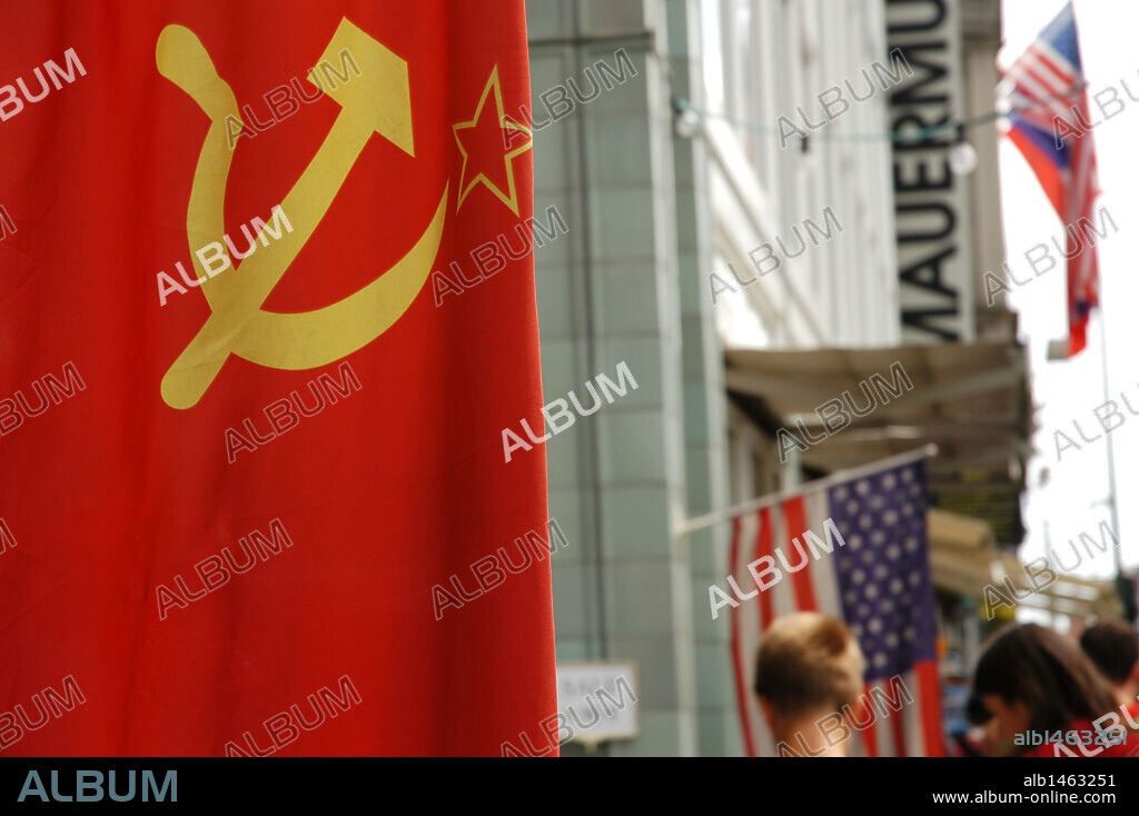 Flag of the former USSR in Checkpoint Charlie, the most famous of the crossing points of the Berlin Wall between the two parts of the city. Berlin. Germany.