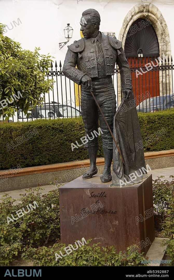 Statue of torero Curro Romero, Francisco Romero López in front of a bullfighting arena, bullring in Seville, Andalusia, Spain