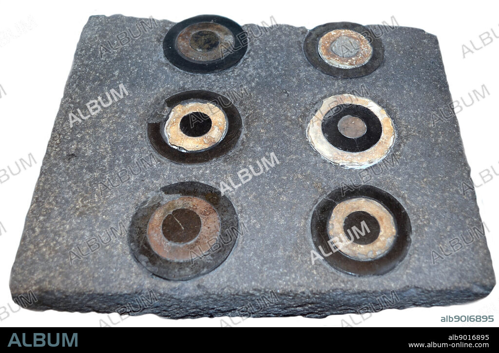 Black Basalt Slab with Inlays of Black and White Stone 8th Century B.C. Part of a paved platform in front of the temple of the God Haldi. Turkey.