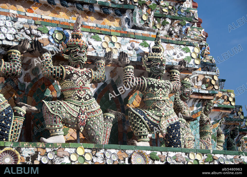 In Buddhist mythology, the Yak?a (Yaksha or Yak) are the attendants of Vaisrava?a, the Guardian of the Northern Quarter, a beneficent god who protects the righteous. The term also refers to the Twelve Heavenly Generals who guard Bhai?ajyaguru, the Medicine Buddha. Wat Arun Rajwararam (Temple of the Dawn), full name Wat Arunratchawararam Ratchaworamahawihan, is a Thai Buddhist temple on the Thonburi west bank side of the Chao Phraya River in Bangkok. It is named after Aruna, the Indian God of Dawn. A monastery has stood here since the Ayutthayan period (1351 - 1767), but the temple's outstanding feature, the Khmer-style central prang, was not begun until 1809, during the reign of King Buddha Loetla Nabhalai (Rama II).