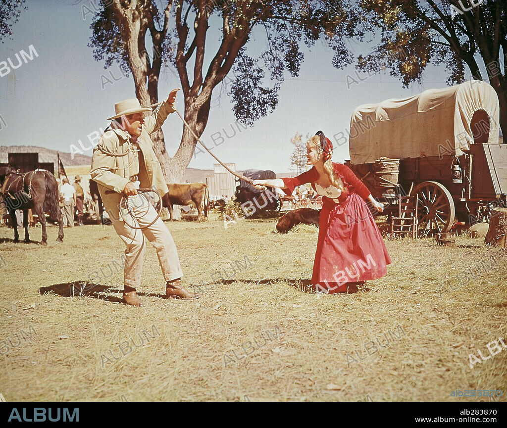 DEBBIE REYNOLDS and ROBERT PRESTON in HOW THE WEST WAS WON, 1962, directed by GEORGE MARSHALL, HENRY HATHAWAY, JOHN FORD and RICHARD THORPE. Copyright M.G.M/CINERAMA.