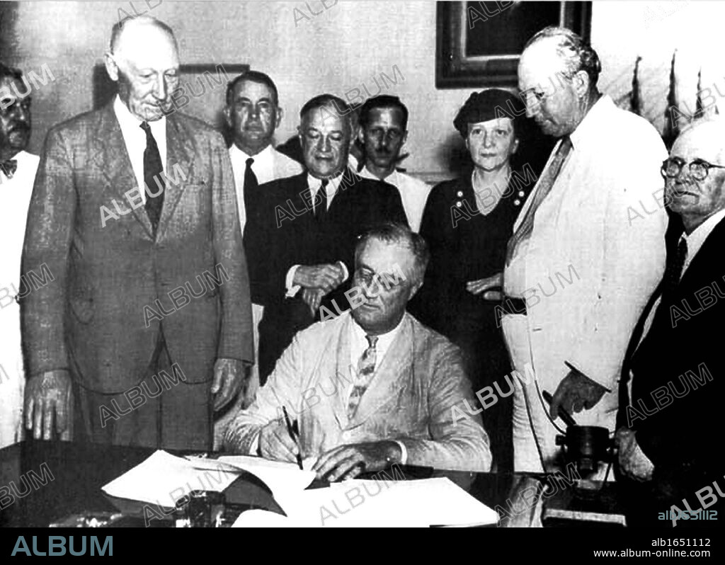 United States President Franklin D. Roosevelt signing the Social Security Bill in 1935.
