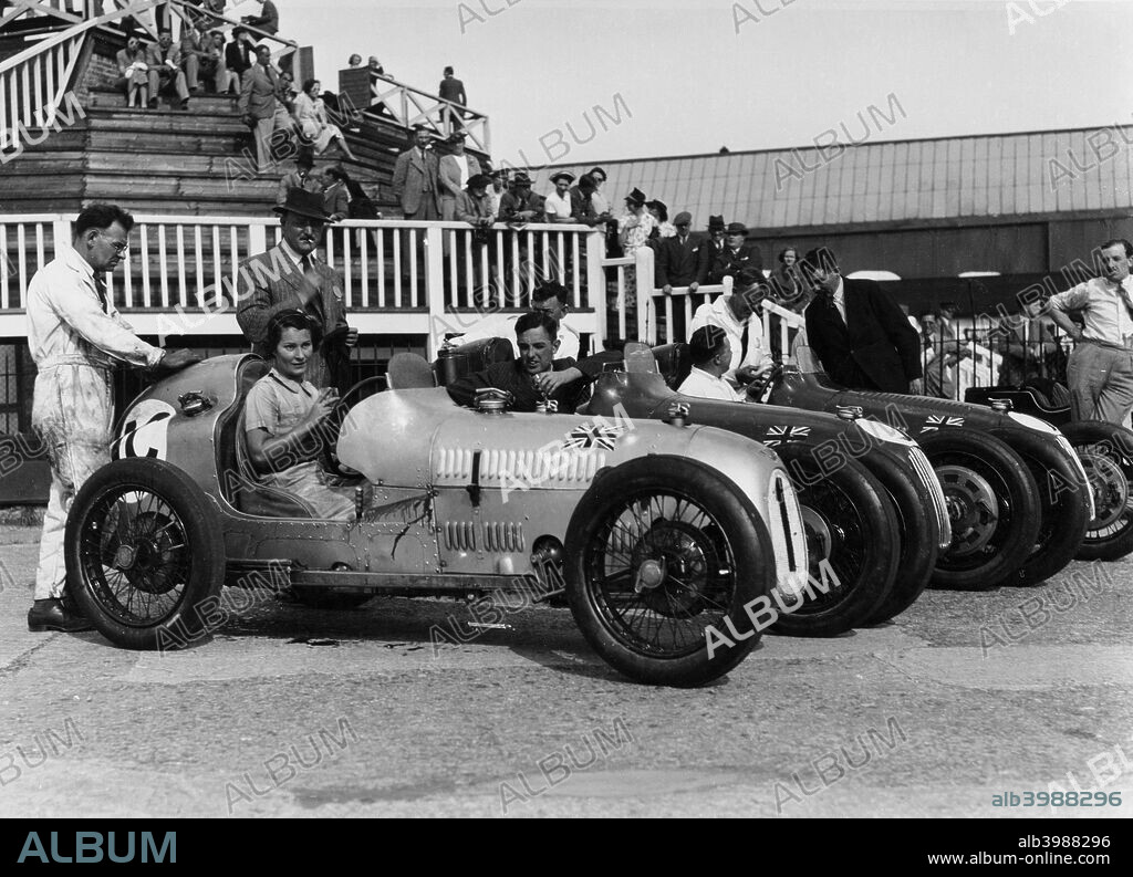The Austin 7 team at Brooklands, Surrey, 1937. Kay Petre is at the wheel of the first car on the left, Charles Goodacre is in the car next to hers, with Bert Hadley in the car on the far right.