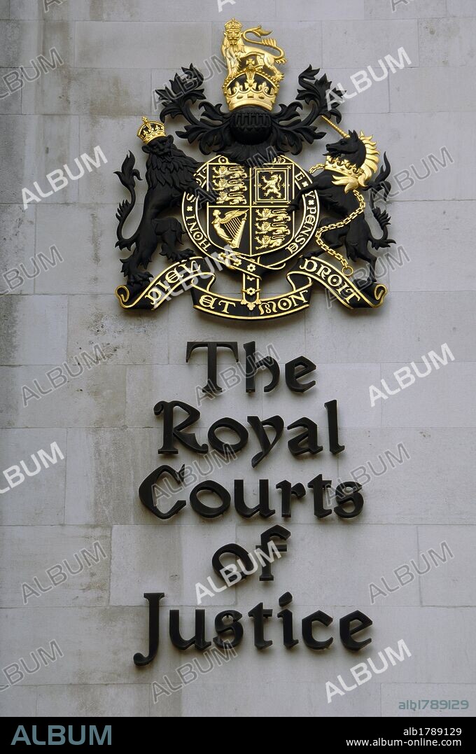 United Kingdom, England, London. The Royal Courts of Justice (Law Courts). Exterior detail. Name of The Royal Courts of Justice (Law Courts) and the Royal coat of arms of the United Kingdom.