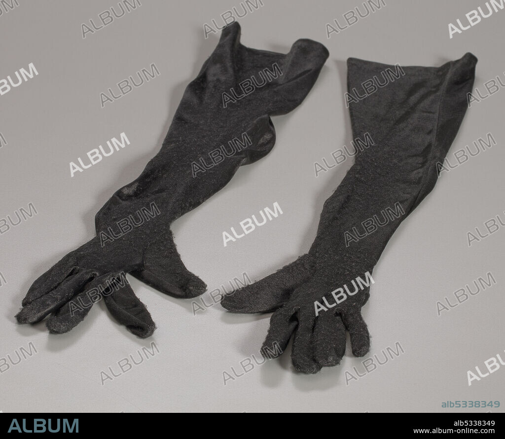 ISAAC MIZRAHI. Elbow-length black gloves, part of a costume worn by African-American singer-songwriter, model and actor Cindy Herron (born 1961), a founding member of the R&B/pop group En Vogue. The costume, which was comprised of a red dress (.1), a bra (.2), a pair of elbow-length black gloves (.3), and a pair of black heels (.4ab), were worn by Herron in the music video "Giving Him Something He Can Feel" (1992).