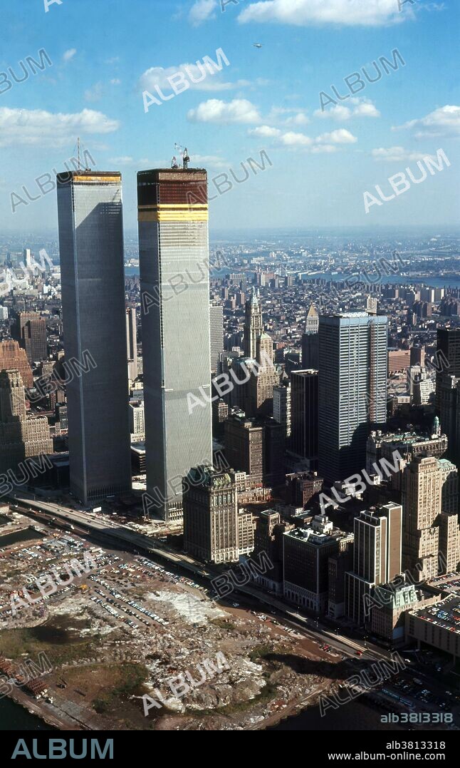 The twin towers of the World Trade Center being built in Lower Manhattan, New York City, United States. It featured landmark twin towers, which opened on April 4, 1973, and were destroyed as a result of the September 11 attacks. The topping out ceremony of 1 WTC (North Tower) took place on December 23, 1970, while 2 WTC's ceremony (South Tower) occurred later on July 19, 1971. The first tenants moved into the North Tower on December 15, 1970; the South Tower accepted tenants in January 1972. When the World Trade Center twin towers were completed, the total costs to the Port Authority had reached $900 million. The ribbon cutting ceremony was on April 4, 1973.