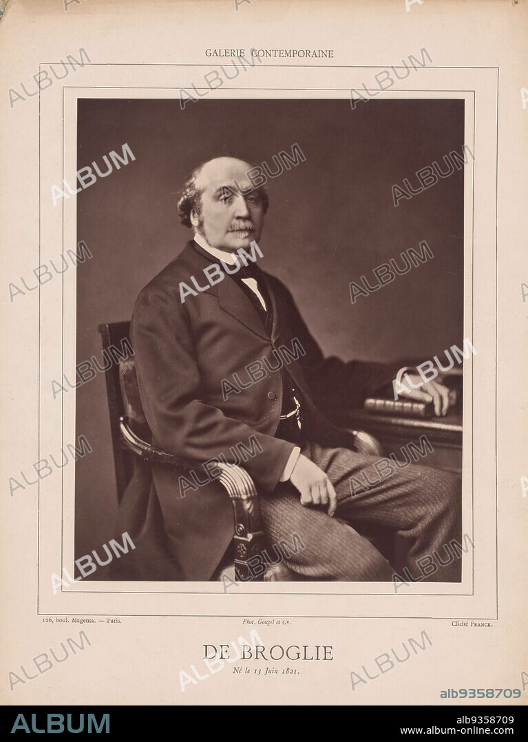 De Broglie. Né le 13 Juin 1821.Galérie contemporaine, littéraire, artistique (series title), The Frenchman Jaques Victor Albert, duc de Broglie (1821-1901) was a diplomat, politician, historian and writer. He is seated at a table, his left arm resting on the table and a book., François Marie Louis Franck, printer: Goupil & Cie. (mentioned on object), Paris, in or after 1876 - in or before 1884, photographic support, cardboard, height 232 mm × width 187 mmheight 354 mm × width 270 mm.