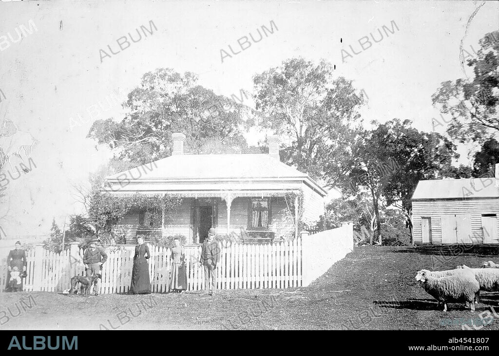 Negative - Wy Yung, Victoria, circa 1896, The Counihan family in front of the homestead on 'Emerald Hill' farm. Outbuildings including a shed, harness room and loose box in the background. There are also sheep in the photograph.