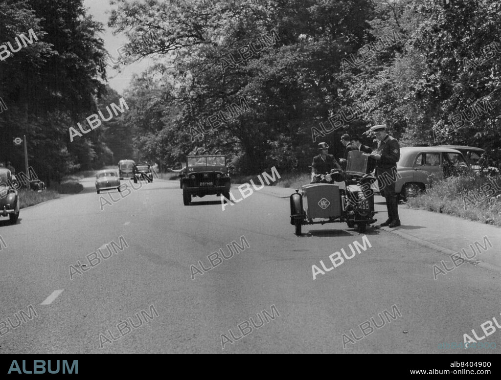 Duke Of Kent In Road Smash - An R.A.C. patrolman at the scene of the accident.The Duke of Kent, was taken to hospital to-day following a road smash near Sunningdale, Berkshire. The shooting brake which he was driving was in collision with  another car driven by a Mr. R.J. Higton, of Kensington. Mr. Higton was only slightly injured. June 20, 1954. (Photo by Daily Mail Contract Picture).