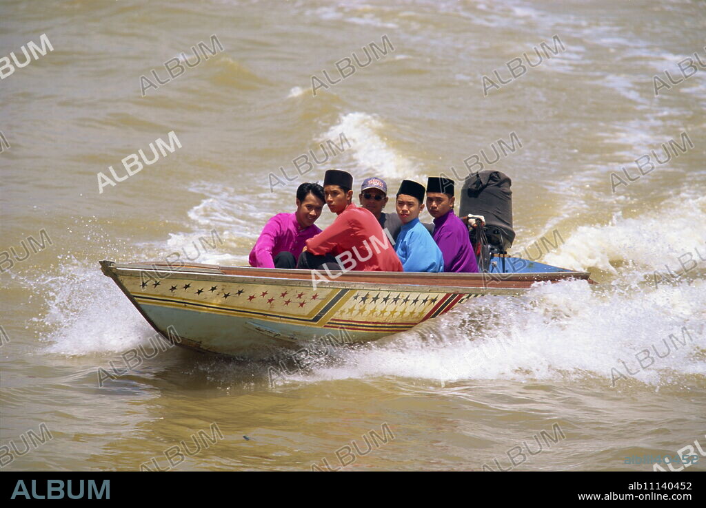 A group of men in a water taxi crossing the Brunei River in Bandar Seri Begawan, in Brunei Darussalam, Borneo, Southeast Asia, Asia.