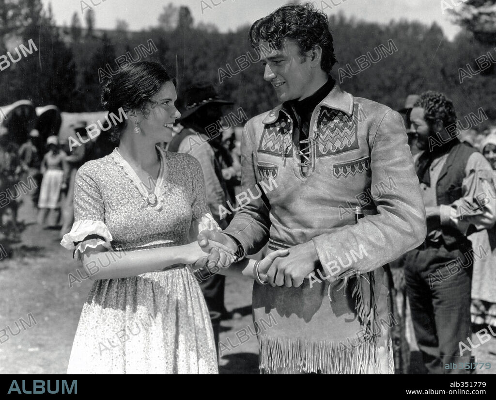 JOHN WAYNE and MARGUERITE CHURCHILL in THE BIG TRAIL, 1930, directed by RAOUL WALSH. Copyright FOX FILMS.